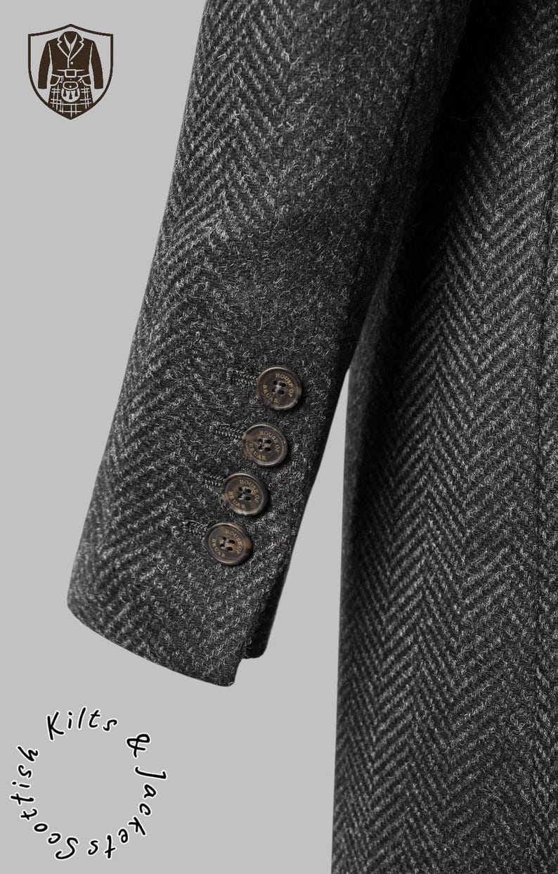 May include: Close-up of a dark gray herringbone tweed jacket sleeve with four brown buttons. The jacket has a classic design and is likely part of a formal wear collection. The image also includes a Scottish emblem and the words "Scottish Kilts & Jackets".