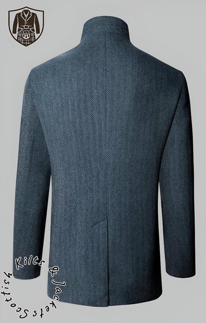 May include: A dark blue herringbone pattern jacket with a mandarin collar. The back of the jacket is visible, showcasing the tailored fit and the fabric's texture. The words "Scottish Kilts & Jackets" are written in a circular pattern.