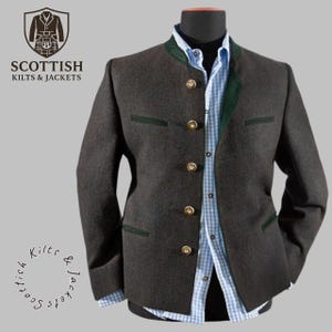 May include: A dark grey jacket with gold buttons and green trim, displayed on a mannequin. The jacket is paired with a light blue and white checked shirt. The text "SCOTTISH KILTS & JACKETS" is visible in the upper left corner.