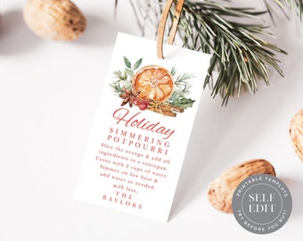 May include: A white tag featuring a watercolour illustration of an orange slice, cinnamon sticks, and greenery. The tag reads "Holiday Simmering Potpourri" with instructions. A leather string is attached.