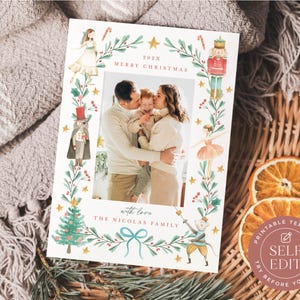May include: A rectangular Christmas photo card template featuring a central photograph of a family. The border is decorated with watercolor illustrations of a ballerina, a nutcracker, a mouse, a Christmas tree, and greenery. Text reads 202X MERRY CHRISTMAS and with love THE NICOLAS FAMILY.