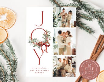 May include: A vertical Christmas photo card template featuring the word JOY in red, with a watercolor wreath replacing the letter O. The design includes three photo slots on the right and space for family names at the bottom, with text reading merry christmas, THE BRADFORD FAMILY.