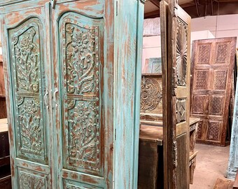 Vintage Carved Wood Armoire: Distressed Blue Boho Cabinet with Brass Studs