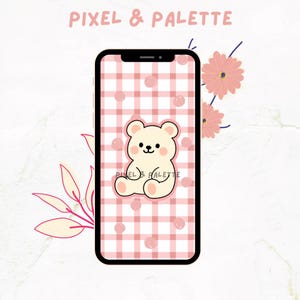 May include: A smartphone displays a pink and white checkered pattern with a cartoon bear illustration. The phone's screen also features the text "Pixel & Palette" and the bear illustration has the text "Pixel & Palette" below it. Pink flowers and leaves are in the background.