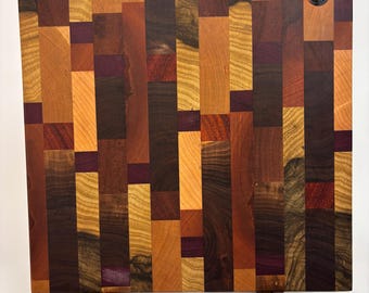 A multi-purpose end grain cutting board, handmade using (mostly!) local lumber. Great for cutting at the bar or for serving.