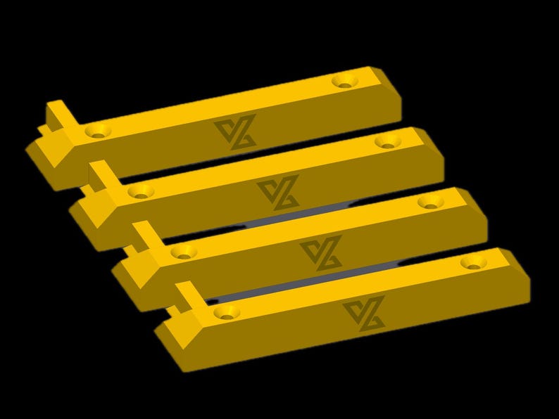 May include: Four yellow rectangular parking kerbs arranged in a parallel formation. Each kerb features a bevelled edge, two circular mounting holes, and a dark grey logo consisting of a stylised letter V and Z integrated into a geometric shape.