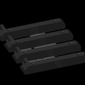 May include: A set of four black, rectangular mounting brackets arranged in a parallel formation. Each bracket features a distinct geometric logo embossed on the surface and two pre-drilled circular holes for installation purposes.