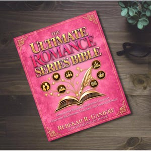 May include: A pink book titled The Ultimate Romance Series Bible by Rebekah R. Ganiere. The cover features a gold quill pen, an open book, and circular icons depicting a heart, people, mountains, a castle, a crown, and an open book.