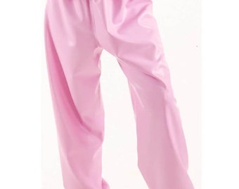 May include: Light pink pants with a relaxed fit, featuring a gathered waist and elastic cuffs at the ankles. The pants are made of a smooth, possibly synthetic material, and are shown against a white background.