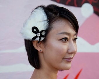 Cream Feather Fascinator with black velvet bow and swarovski jewel