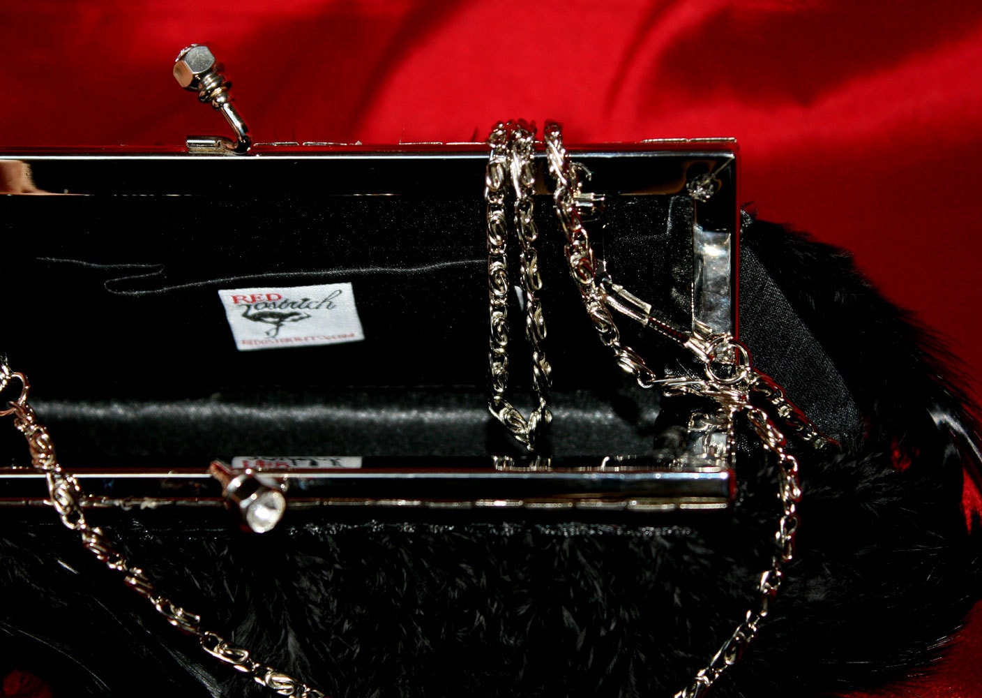 True Decadence pleated box clutch bag in black | ASOS