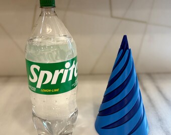 May include: A clear plastic bottle of Sprite lemon-lime soda next to a blue and dark blue 3D printed cone.