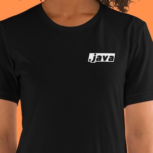 May include: Black t-shirt with the word "java" in white, displayed in a rectangular box on the chest. The shirt has short sleeves and a crew neck. The background is a solid orange color.