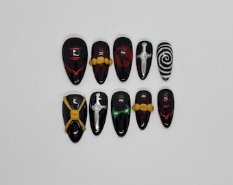 Unhas postiças de gel inspiradas em Damian Wayne e Robin da DC