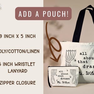 May include: A white tote bag and matching pouch with black handles and accents. Both feature the text "all about that drama" and a curtain design. The tote bag is approximately 14 inches wide and 9 inches tall. The pouch has a zipper closure.