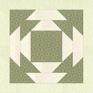 Op de afbeelding: Een quiltblok met een wit centrum en groene buitenranden. Het centrum is gemaakt van vier witte driehoeken die een vierkant vormen. De buitenranden zijn gemaakt van vier groene driehoeken die een vierkant vormen.
