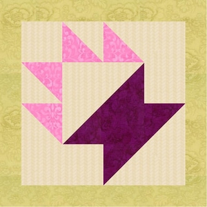 May include: A square quilt block with a basket design. The basket is made of pink triangles with a floral pattern and a large, deep purple arrow shape. The background is a light beige with a subtle herringbone pattern, set against a yellow-green floral border.