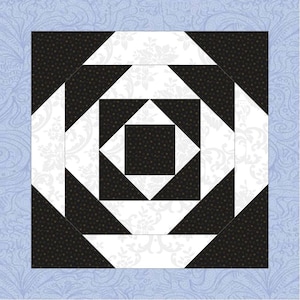 May include: A square quilt block with a geometric design. The central pattern features a black square surrounded by white diamond shapes and black triangles. The background is a light blue with a floral pattern.