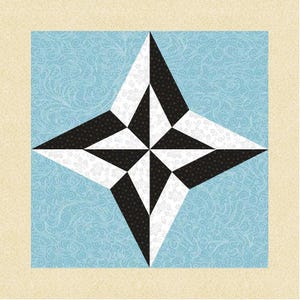 May include: A geometric quilt block featuring a star design. The star is composed of black and white triangles set against a light blue background with a swirling pattern. The block is framed by a beige border.