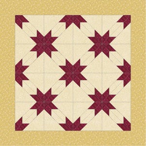 May include: A quilt with a repeating star pattern in burgundy and cream. The stars are set against a cream background, with a gold border. The quilt is made of fabric squares sewn together.