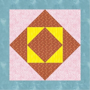 May include: A quilt block featuring a brown diamond shape in the centre, surrounded by four yellow triangles, all on a pink background.