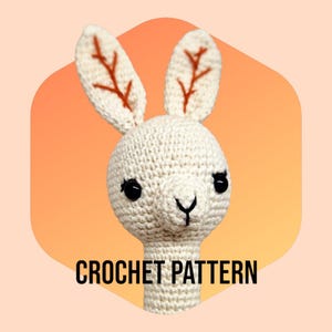 May include: Crochet pattern for a white amigurumi llama with brown ears and black eyes. The pattern is titled "CROCHET PATTERN".