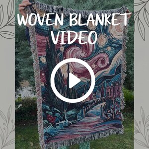 May include: A rectangular woven blanket featuring a colourful artistic reproduction of a night landscape with swirling clouds, stars, a tall dark cypress tree, and a bridge. The blanket has a fringed edge and displays the text WOVEN BLANKET VIDEO.