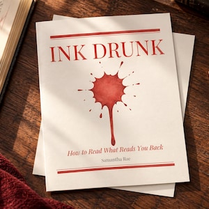 May include: A white book cover titled INK DRUNK in red serif font with a red watercolor ink splatter graphic in the center. Below the graphic, the subtitle reads How to Read What Reads You Back, followed by the author name Samantha Rae in red.