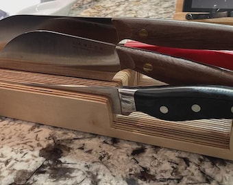 Knife holding block for drawers