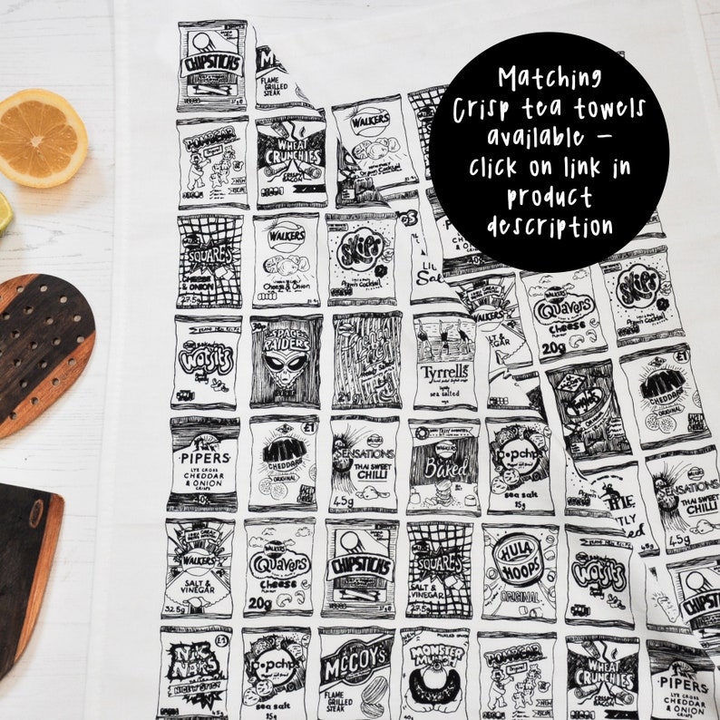 May include: A white tea towel with a black and white illustration of various popular British crisp brands. The text "Matching Crisp tea towels available - click on link in product description" is printed in black on a white circle in the upper right corner of the towel.