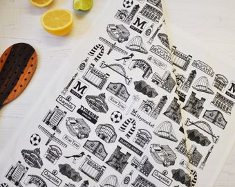 May include: Black and white illustration of various landmarks and symbols of Newcastle, England, including the Tyne Bridge, the Quayside, and the Tyne Theatre & Opera House. The design is repeated on a white background.