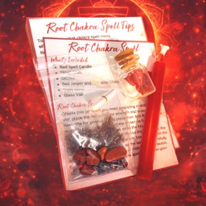 May include: A Root Chakra spell kit containing a red candle, a small glass vial with a cork stopper, a clear plastic bag filled with red jasper stones and dark herbs, and printed instruction cards titled Root Chakra Spell and Root Chakra Spell Tips.