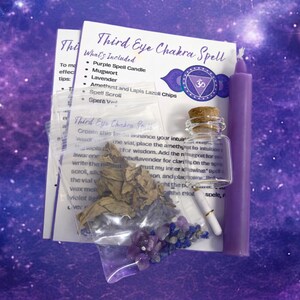 May include: A Third Eye Chakra Spell kit including a purple taper candle, a small glass vial with a cork stopper, a rolled paper scroll, and clear plastic bags containing dried mugwort, lavender, and small amethyst and lapis lazuli stone chips.