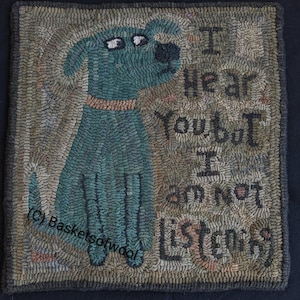 May include: Hand-hooked rug featuring a teal dog with a brown collar. The rug has the text "I hear you but I am not listening" in black lettering. The background is a mix of neutral colors.