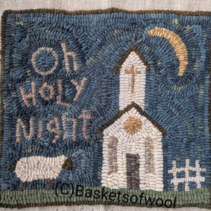 May include: Hand-hooked rug with a blue background and the words "Oh Holy Night." The image features a white church with a cross, a crescent moon, and a sheep. The rug is framed with a brown border.
