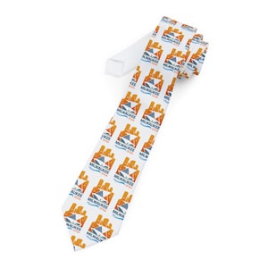 May include: White necktie with a repeating pattern of orange and blue graphics and the text "MILWAUKEE 2026". The tie is made of a smooth fabric and is suitable for formal occasions.