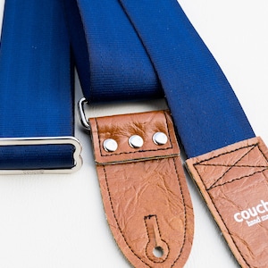 The Navy And Buckskin Seat Belt Guitar Strap, Blue Recycled Seatbelt With Tan Vegan Leather Ends and Guitar Pick Holder