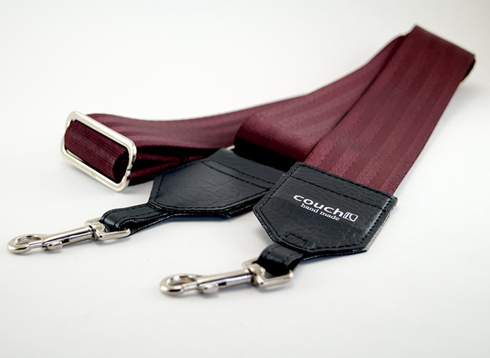 red banjo strap that looks like a seatbelt