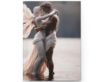 May include: A white marble sculpture of a couple embracing, standing in a body of water. The man is holding the woman close, and they are both looking at each other. The sculpture is set against a backdrop of a lake and sky.