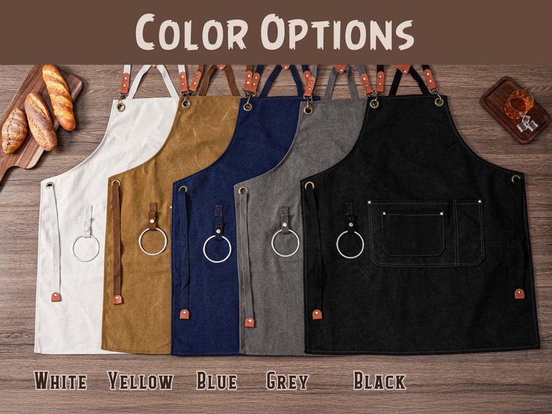 May include: Aprons in white, yellow, blue, grey, and black, with leather straps and metal ring details. The aprons are displayed with the text "COLOR OPTIONS" and the color names "WHITE", "YELLOW", "BLUE", "GREY", and "BLACK".