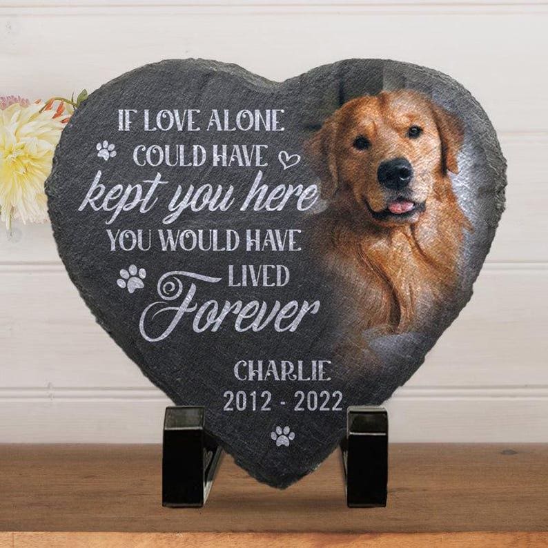 May include: Heart-shaped memorial stone with a photo of a golden retriever and the inscription "If love alone could have kept you here, you would have lived forever." The dog's name, Charlie, and dates 2012-2022 are also included.