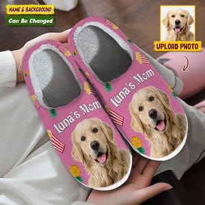 May include: Pink slippers with a Golden Retriever's face and the text "Luna's Mom". The slippers have a white interior, pineapple and striped designs. The image includes a photo upload option.