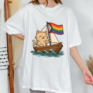 Purride Boat Shirt, Cute LGBTQ Cat Shirt, Pride Flag Cat in Boat Tee, Funny Inclusive Pride T-Shirt, Queer Cat Lover Gift, Pride Month tee.