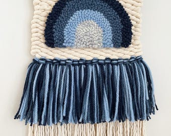 Woven wall hanging with rainbow accent fiber art weaving and punch needle embroidery