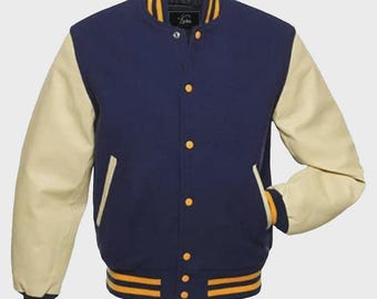 May include: A navy blue varsity jacket with cream-colored sleeves. The jacket features gold and navy striped trim on the cuffs and hem, and gold buttons down the front. The collar is navy blue with gold trim. The jacket has a classic, sporty look.