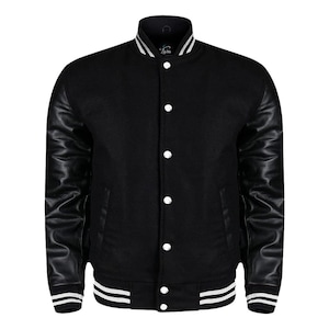 May include: Black varsity jacket with black leather sleeves, white striped cuffs, and a white collar. The jacket has a button-up front and two front pockets. The jacket has the word "Zara" embroidered on the collar.