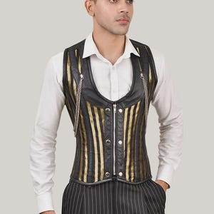 May include: A black and gold striped vest with a zipper closure and silver chains. The vest has a low, scoop neckline and is made of a leather-like material.
