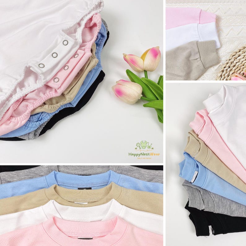 Op de afbeelding: Een collectie babykleding in diverse kleuren, waaronder wit, roze, beige, blauw, grijs en zwart. De afbeelding toont verschillende rompertjes met drukknoopsluitingen en crewneck sweatshirts. Het HappyNestWear-logo is zichtbaar.