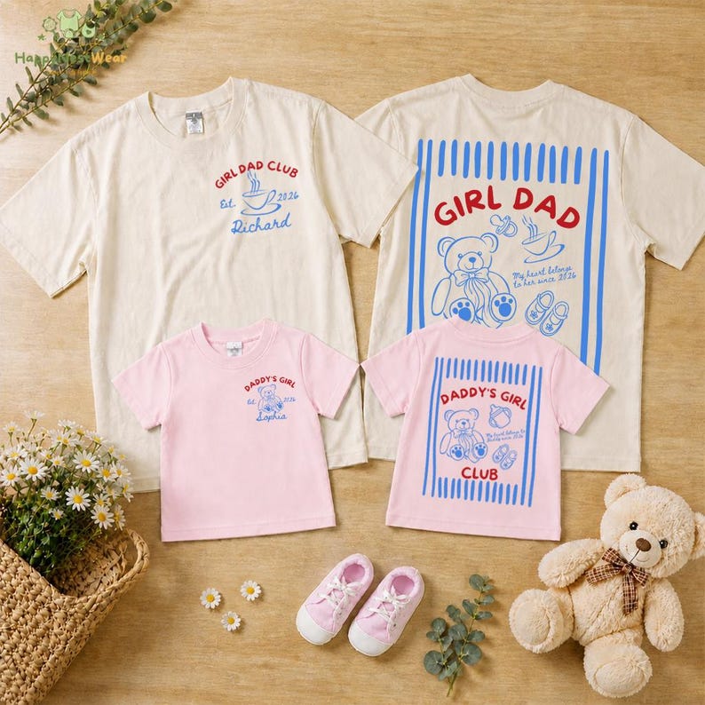 May include: A collection of matching t-shirts in cream and pink, featuring the text "GIRL DAD CLUB" and "DADDY'S GIRL" with teddy bear graphics. Includes pink sneakers and a teddy bear.