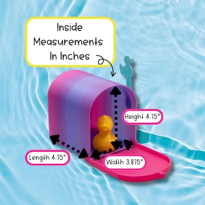 May include: A pink and purple gradient mailbox with a yellow rubber duck inside. The mailbox features a light blue flag and a pink door. Text labels indicate inside measurements of 4.75 inches in length, 4.75 inches in height, and 3.875 inches in width.